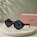 MIU MIU Black Diamond Geometric Sunglasses – Angular Rimless Top Acetate Frame with Gold Logo