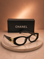 CHANEL Black Oval Eyeglasses – Glossy Acetate Frame with Gold CC Logo