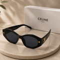 CELINE Triomphe Oval Sunglasses – Glossy Black Acetate Frame with Gold Hardware