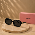 MIU MIU Black Acetate Rectangle Sunglasses – Dark Grey Lenses with Gold Monogram Hardware