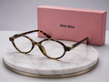 MIU MIU Tortoiseshell Oval Eyeglasses – Havana Acetate Frame with Gold Logo