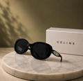 CÉLINE Black Oval Polarized Sunglasses – Glossy Acetate Frame with Gold Triomphe Temple Emblem