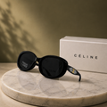 CÉLINE Black Oval Polarized Sunglasses – Glossy Acetate Frame with Gold Triomphe Temple Emblem
