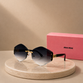 MIU MIU Rimless Diamond Geometric Sunglasses – Dark Grey Gradient Lenses with Gold Monogram Hardware