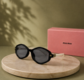 MIU MIU Black & Cream Geometric Sunglasses – Two-Tone Acetate Frame with Gold Logo