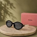 MIU MIU Black & Cream Geometric Sunglasses – Two-Tone Acetate Frame with Gold Logo