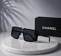 CHANEL Black Shield Sunglasses – Oversized Flat-Top Frame with Gold Logo Temples