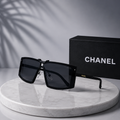 CHANEL Black Shield Sunglasses – Oversized Flat-Top Frame with Gold Logo Temples